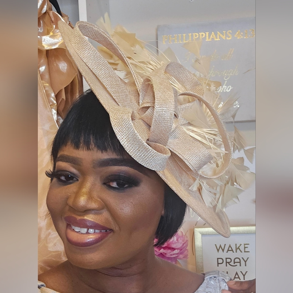 Women's Cream Fascinator Hat with Feather and Loop Detail